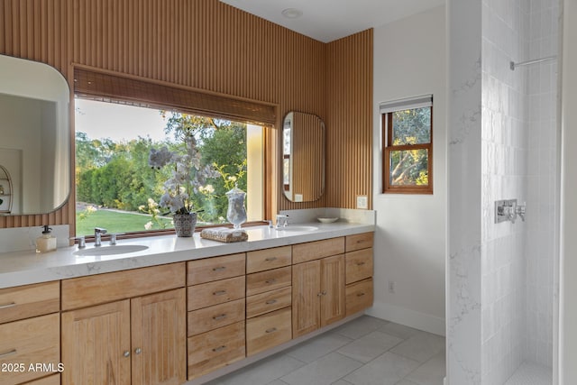 6648 E Horseshoe Rd, Paradise Valley, AZ 85253 - bathroom featuring double vanity, a tile shower, a sink, and tile patterned flooring