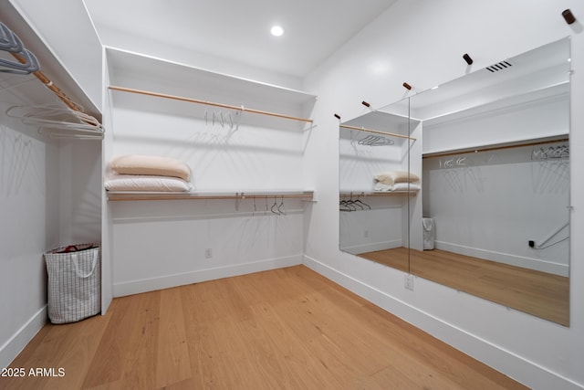 6648 E Horseshoe Rd, Paradise Valley, AZ 85253 - walk in closet with wood finished floors and visible vents