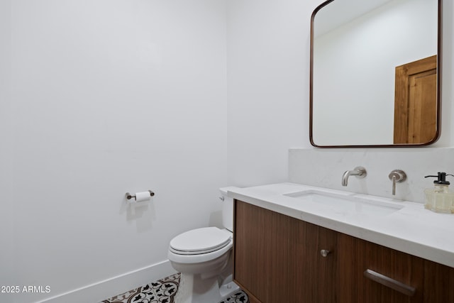 6648 E Horseshoe Rd, Paradise Valley, AZ 85253 - half bathroom with toilet, tile patterned floors, baseboards, and vanity