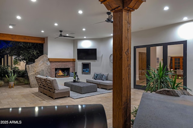 6648 E Horseshoe Rd, Paradise Valley, AZ 85253 - living area with recessed lighting, ceiling fan, a stone fireplace, and stone finish floor