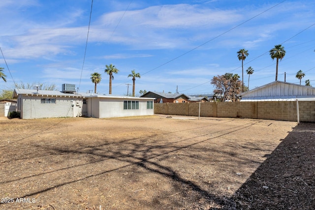 view of yard featuring fence private yard and central AC unit