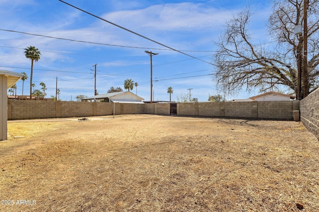 view of yard with a fenced backyard