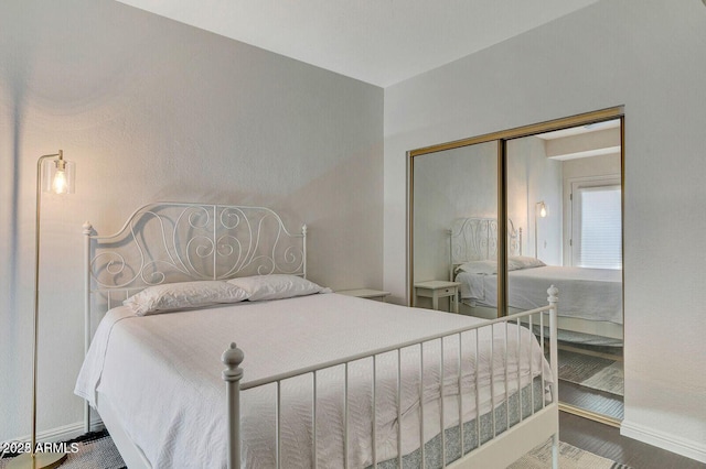 101 N 7th St Unit 225, Phoenix, AZ 85034 - bedroom featuring baseboards and a closet