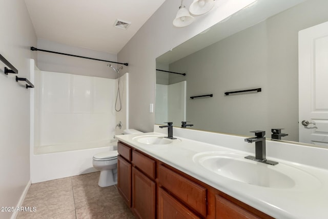 bathroom featuring double vanity, tub / shower combination, a sink, and visible vents