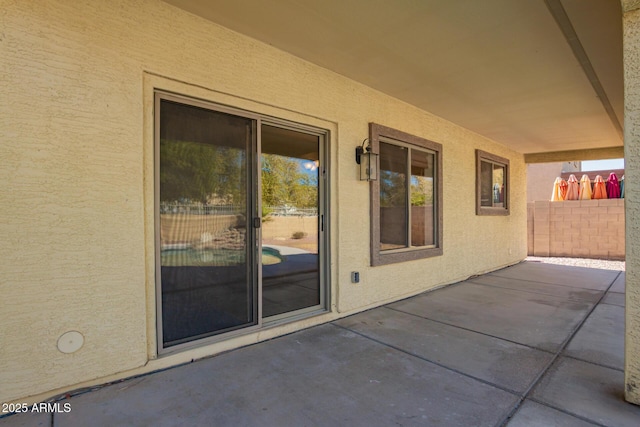 view of patio / terrace featuring fence