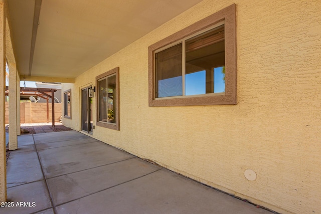 view of patio / terrace featuring fence