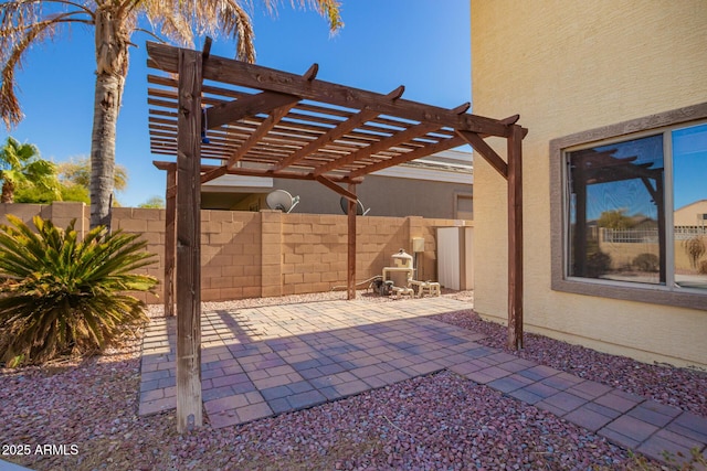 view of patio with fence and a pergola