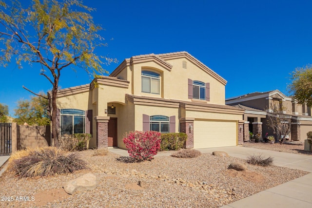 view of front of property featuring an attached garage, fence, a tile roof, concrete driveway, and stucco siding