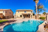 view of pool with fence, a fenced in pool, and a patio