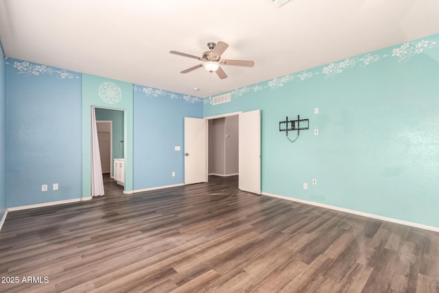 unfurnished bedroom with ceiling fan, dark hardwood / wood-style floors, and ensuite bath