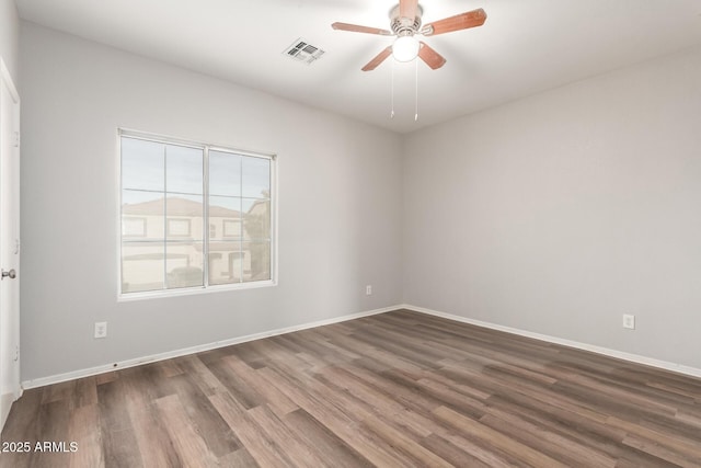 unfurnished room featuring ceiling fan and dark hardwood / wood-style floors