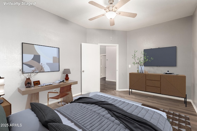 bedroom featuring dark wood-type flooring and ceiling fan