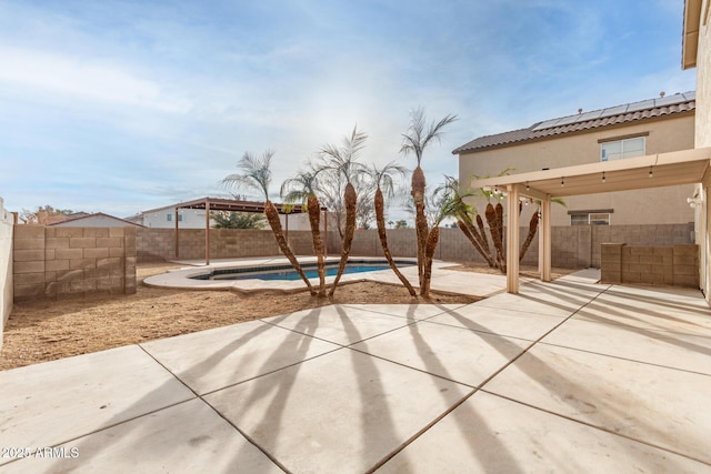 view of patio / terrace featuring a fenced in pool