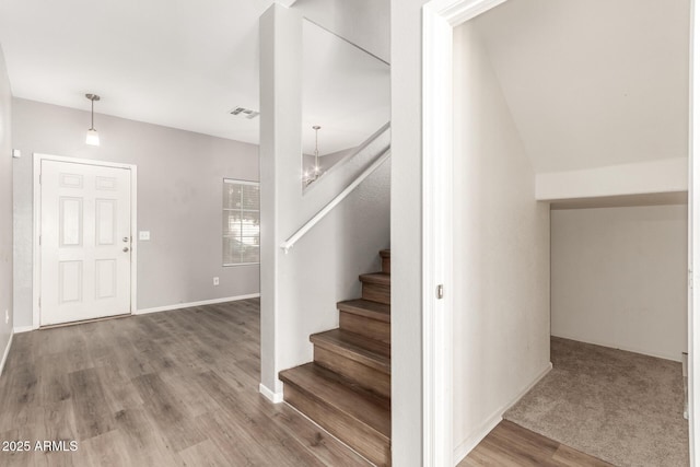 stairway featuring hardwood / wood-style floors