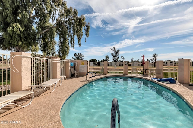 pool featuring fence