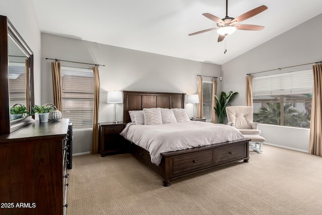 bedroom featuring light colored carpet, baseboards, lofted ceiling, and a ceiling fan