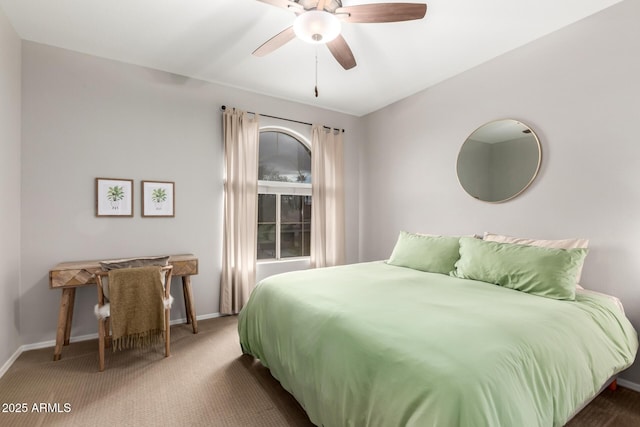 carpeted bedroom featuring a ceiling fan and baseboards