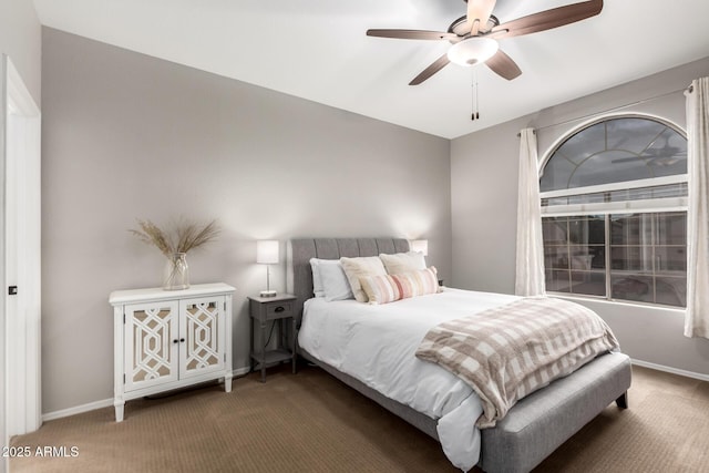 bedroom with a ceiling fan, carpet, and baseboards