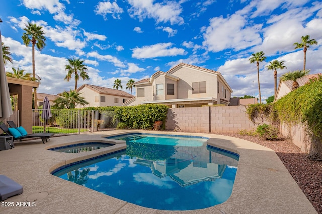 view of swimming pool featuring an in ground hot tub, a fenced backyard, a fenced in pool, and a patio area