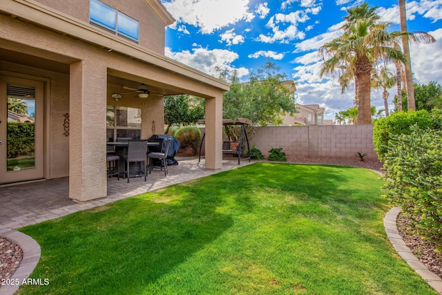 view of yard featuring a ceiling fan, a patio, and fence