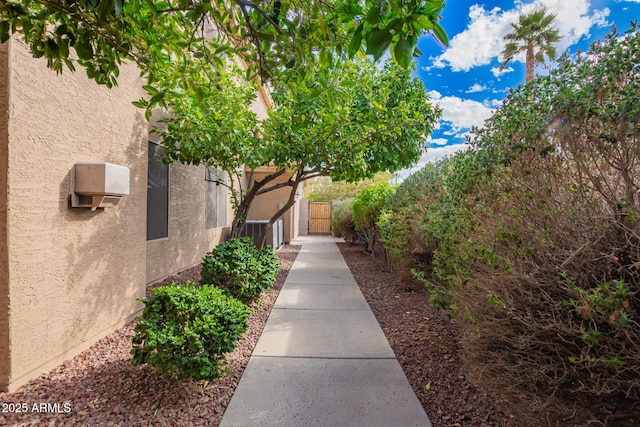 view of home's community featuring a gate and fence