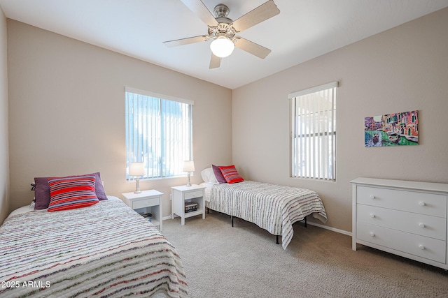 bedroom with light carpet and ceiling fan