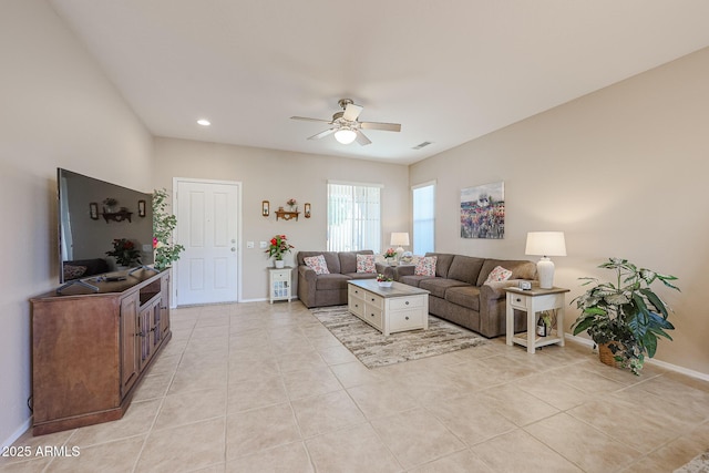 tiled living room with ceiling fan