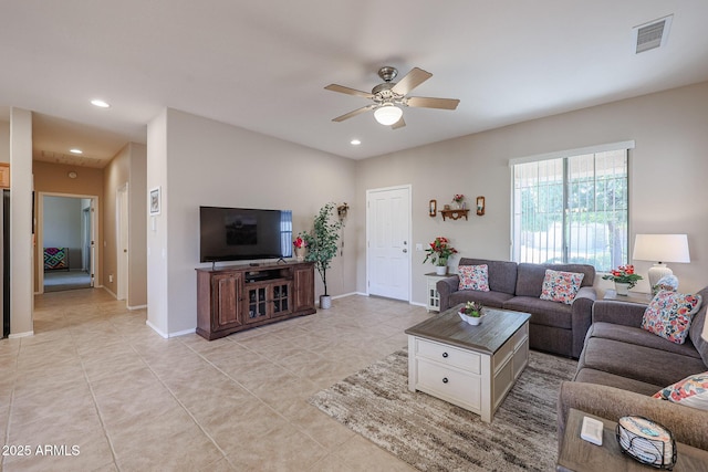 tiled living room featuring ceiling fan