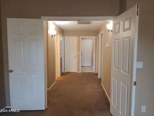 hall with carpet flooring