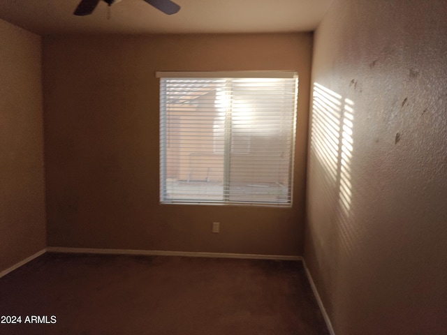 unfurnished room with ceiling fan