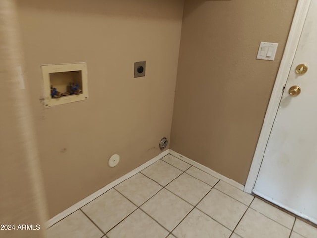 laundry area featuring hookup for a washing machine, hookup for a gas dryer, light tile patterned floors, and electric dryer hookup