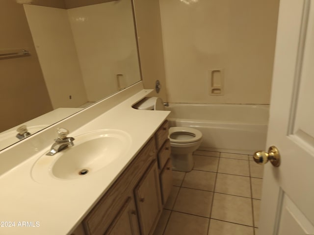 full bathroom with toilet, vanity, tile patterned floors, and washtub / shower combination