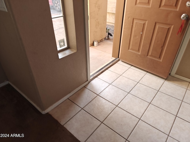 interior space with light tile patterned floors