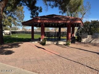 view of property's community with a gazebo and a patio