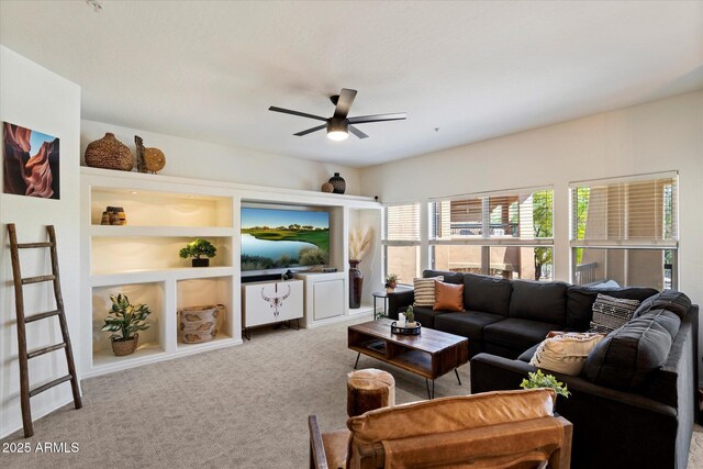 19700 N 76th St Unit 2086, Scottsdale, AZ 85255 - carpeted living room featuring ceiling fan and built in shelves