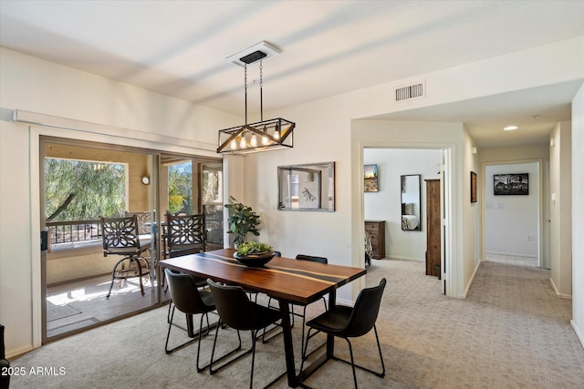 19700 N 76th St Unit 2086, Scottsdale, AZ 85255 - dining area featuring baseboards, carpet floors, visible vents, and a chandelier