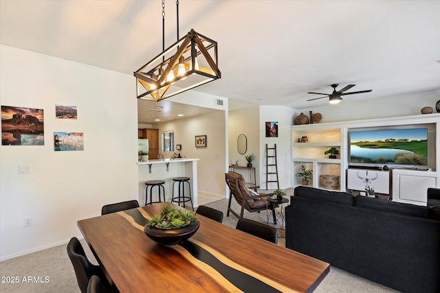 19700 N 76th St Unit 2086, Scottsdale, AZ 85255 - dining area featuring ceiling fan with notable chandelier, baseboards, and light colored carpet