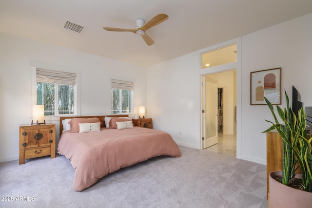 bedroom with light colored carpet and ceiling fan