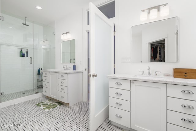 bathroom featuring vanity and a shower with door