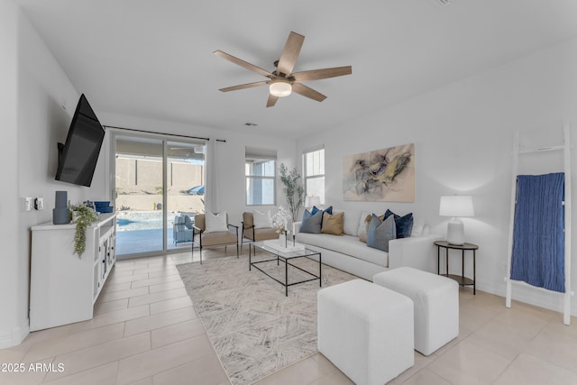 tiled living room featuring ceiling fan