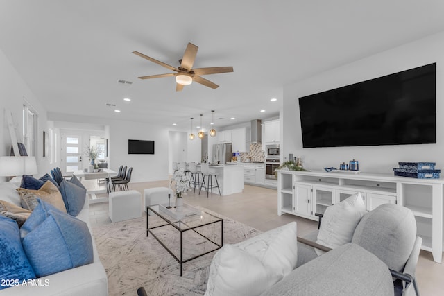 living room with ceiling fan