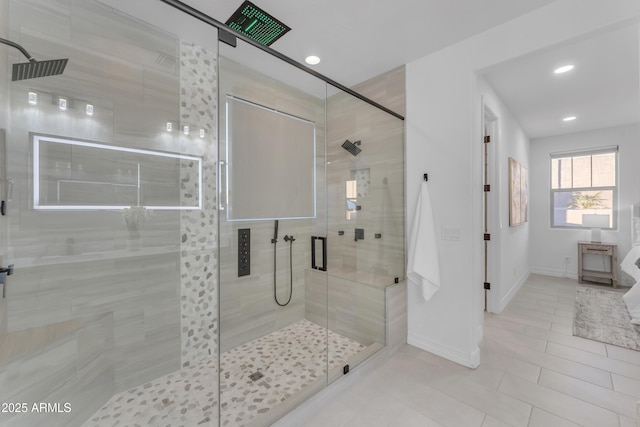 bathroom with tile patterned floors and walk in shower