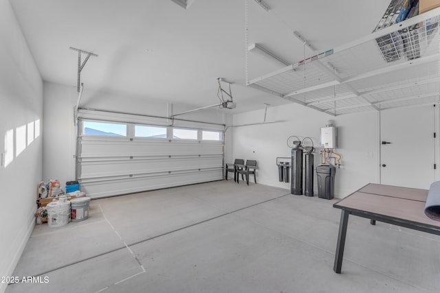 garage with tankless water heater and a garage door opener