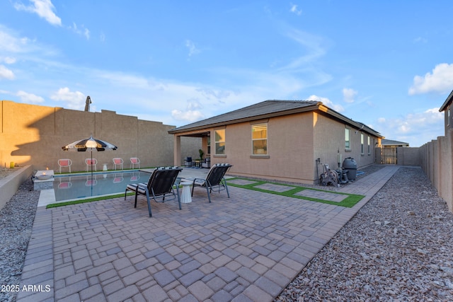 view of patio / terrace with a fenced in pool