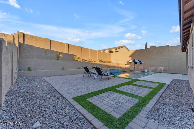 view of yard with a fenced in pool and a patio area