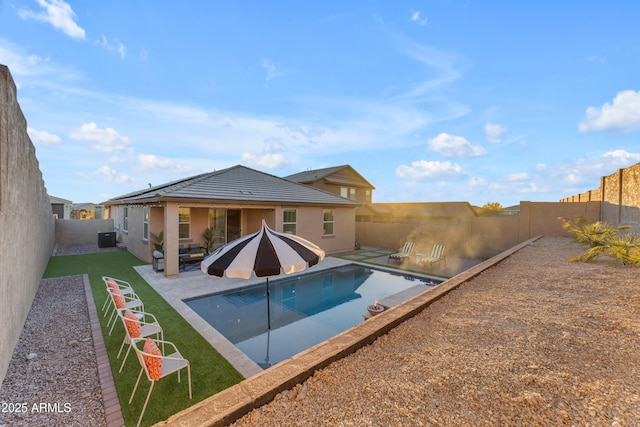 view of pool with a patio area and central AC