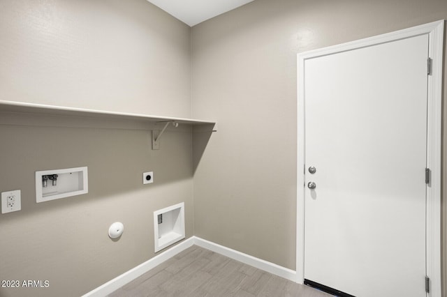 laundry area with hookup for an electric dryer, washer hookup, light hardwood / wood-style floors, and gas dryer hookup