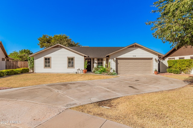 single story home with a front lawn and a garage