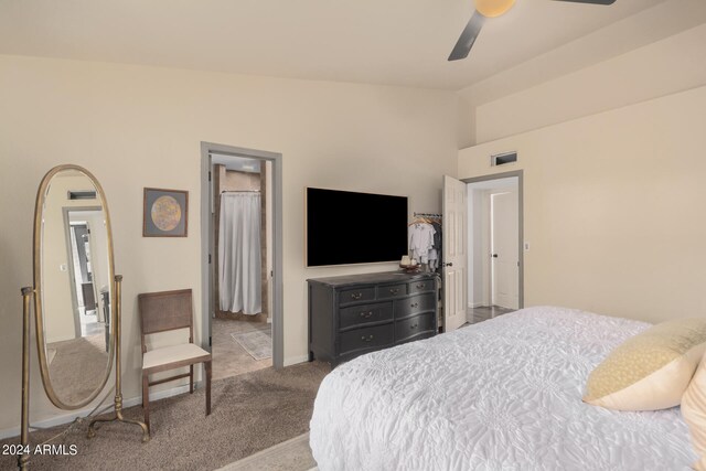 carpeted bedroom with lofted ceiling and ceiling fan