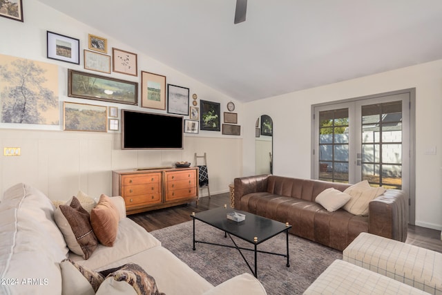 living room with french doors, vaulted ceiling, and dark hardwood / wood-style flooring